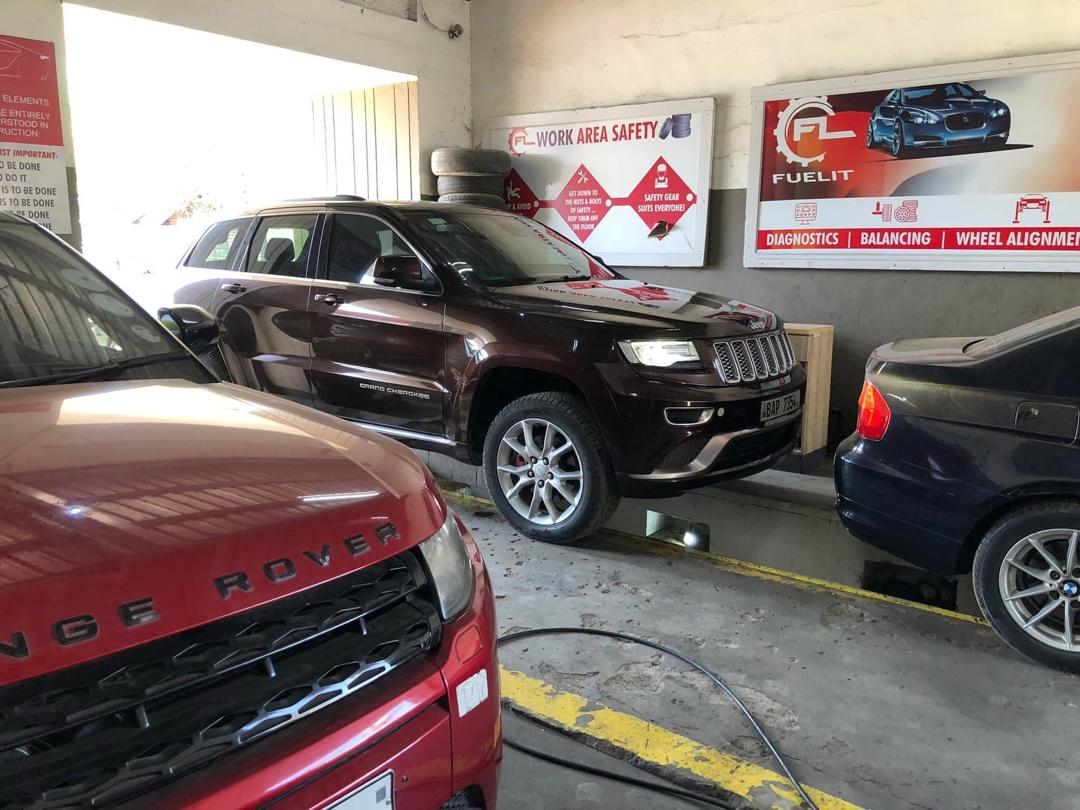 Vehicles on the diagnostics and wheel alignment bay at FuelIT Garage 