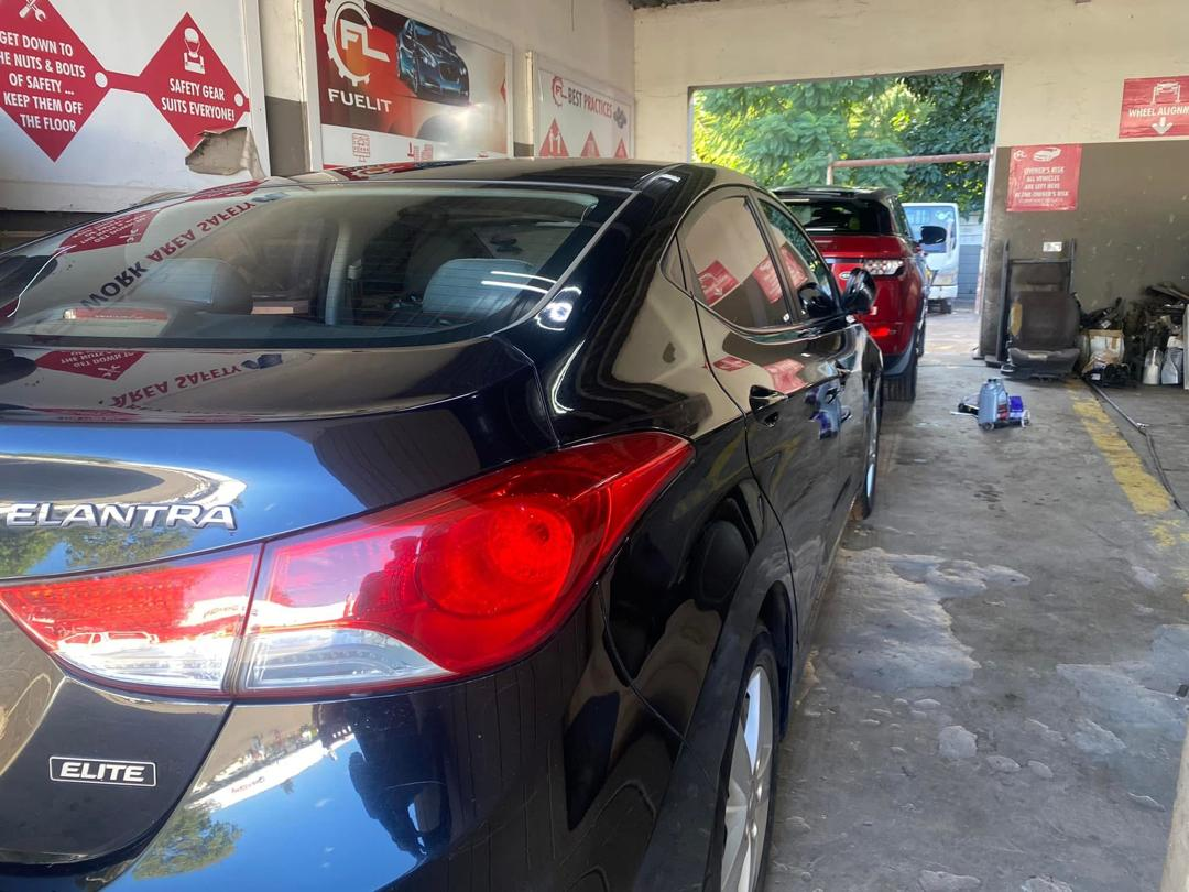 Customer vehicles parked in the FuelIT Garage  workshop